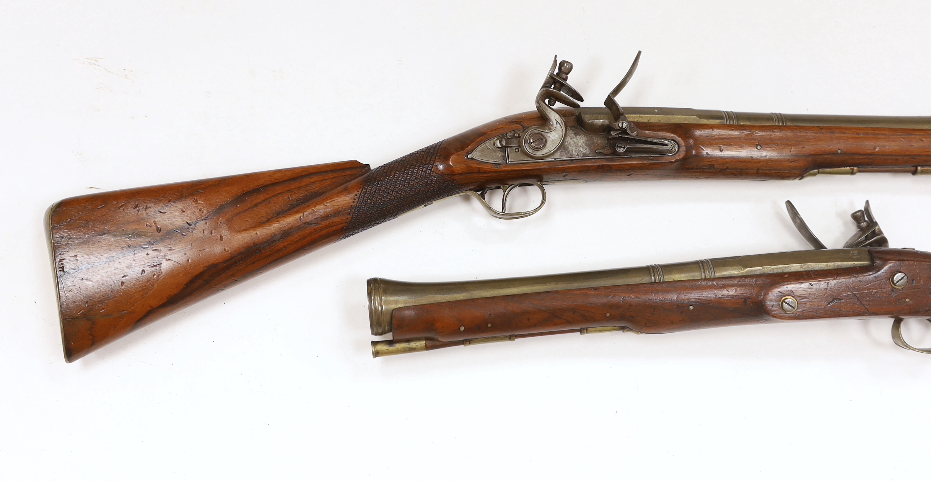 A pair of reproduction 'York Mail' flintlock blunderbusses in a late 18th century style.